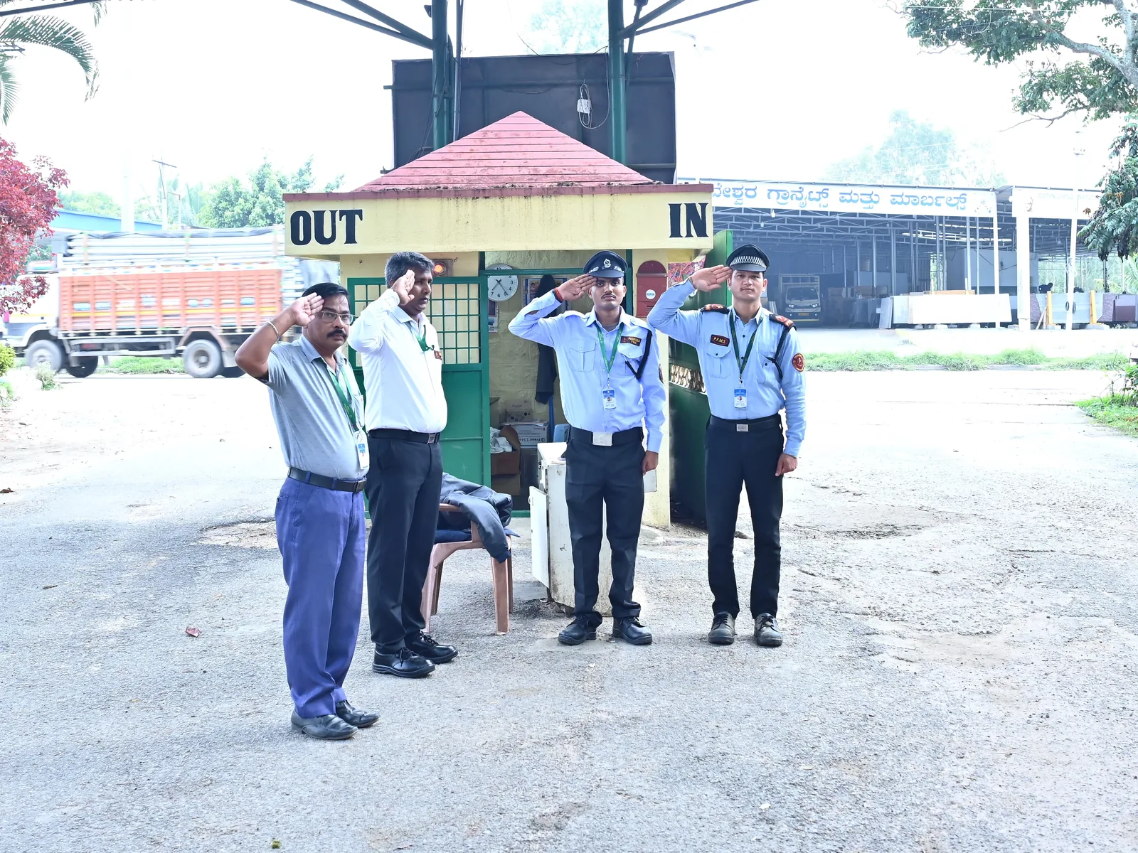 Poorvika FMS guards saluting at a gate sentry post